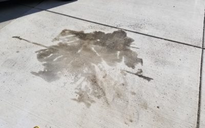 How do I clean stains on my concrete driveway / garage floor?